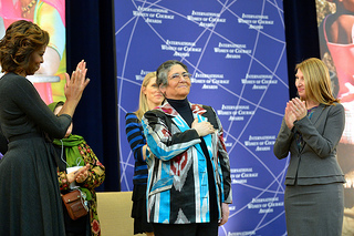 First Lady Michelle Obama Embraces 2014 IWOC Awardee Oinikhol Bobonazarova of Tajikistan